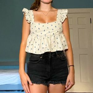 cropped beige tank top with little blue flowers